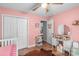 Cozy bedroom with hardwood floors, a ceiling fan, and ample closet space at 1800 Oriole Ct, Monroe, NC 28112