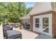 Spacious outdoor deck perfect for entertaining, with grill, seating, and access to lush backyard at 1800 Oriole Ct, Monroe, NC 28112