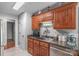 Spacious kitchen showcasing a pantry, ample wood cabinets, a stainless steel sink, and modern appliances at 1800 Oriole Ct, Monroe, NC 28112