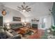 Stylish living room with hardwood floors, a fireplace, and comfortable seating, ideal for relaxation at 1800 Oriole Ct, Monroe, NC 28112