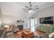 Spacious living room boasts a fireplace, hardwood floors, ceiling fan and comfortable seating at 1800 Oriole Ct, Monroe, NC 28112