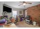Bright office room features exposed brick wall and lots of natural light at 1800 Oriole Ct, Monroe, NC 28112