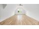 Vaulted bedroom with hardwood floors, ceiling fan, and natural light at 1829 Union St, Charlotte, NC 28205