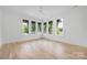 Bedroom with hardwood floors and large window letting in natural light at 1829 Union St, Charlotte, NC 28205