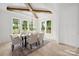 Bright dining room with modern chandelier, wood table, seating for six and lots of natural light at 1829 Union St, Charlotte, NC 28205