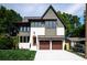 This is a charming two-story home with a two-car garage and a well-manicured front lawn at 1829 Union St, Charlotte, NC 28205