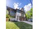Charming two-story home with a modern exterior, two-car garage, and well-manicured lawn at 1829 Union St, Charlotte, NC 28205