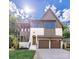 Inviting two-story home showcasing a manicured lawn, two-car garage and craftsman architectural details at 1829 Union St, Charlotte, NC 28205