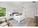 Bright, spacious main bedroom featuring lots of windows, an area rug, and modern furnishings at 1829 Union St, Charlotte, NC 28205