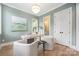 Bright office space with a modern chandelier, soothing paint color and an abundance of natural light at 1829 Union St, Charlotte, NC 28205