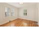 Neutral bedroom featuring hardwood floors, natural light and plantation shutters at 2015 Club Rd, Charlotte, NC 28205