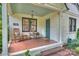 Charming front porch with brick flooring, rocking chairs, and a cozy welcome at 2015 Club Rd, Charlotte, NC 28205