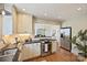 Bright kitchen boasts stainless appliances, granite counters, and seamless flow to adjacent living area at 2015 Club Rd, Charlotte, NC 28205