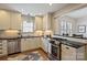 Cozy kitchen with updated stainless steel appliances, subway tile backsplash, and granite countertops at 2015 Club Rd, Charlotte, NC 28205