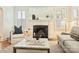 Bright living room featuring a fireplace, modern decor, and lots of natural light at 2015 Club Rd, Charlotte, NC 28205