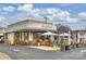 Exterior view of Milkbread restaurant featuring outdoor seating, black and white awnings and appealing storefront at 2015 Club Rd, Charlotte, NC 28205