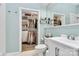 Well-lit bathroom with closet and shower with a large mirror amplifying the space at 2125 Southend Dr # 339, Charlotte, NC 28203