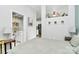 Bright bedroom with view of bathroom featuring white vanity, framed art, and modern lighting at 2125 Southend Dr # 339, Charlotte, NC 28203