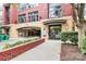 Welcoming building entrance featuring covered parking, beautiful landscaping, and easy access to the lobby at 2125 Southend Dr # 339, Charlotte, NC 28203