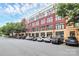 A striking building exterior featuring red brick, cream accents, and convenient parking spaces at 2125 Southend Dr # 339, Charlotte, NC 28203