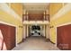 Inviting outdoor hallway leading to a tranquil courtyard, offering a blend of privacy and community at 2125 Southend Dr # 339, Charlotte, NC 28203
