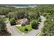 Aerial view of a stunning home with lush landscaping and mature trees at 221 Silvercliff Dr, Mount Holly, NC 28120