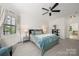 Bright bedroom featuring a ceiling fan, and a window with lots of natural light at 221 Silvercliff Dr, Mount Holly, NC 28120
