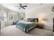 Large primary bedroom with tray ceiling and bay window at 221 Silvercliff Dr, Mount Holly, NC 28120