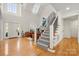 Elegant entryway featuring soaring ceiling, hardwood floors, staircase, and lots of natural light at 221 Silvercliff Dr, Mount Holly, NC 28120