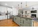 Open concept kitchen with stainless appliances, granite counters, and an expansive center island at 221 Silvercliff Dr, Mount Holly, NC 28120
