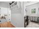 Convenient laundry room adjacent to hall with organizational storage at 221 Silvercliff Dr, Mount Holly, NC 28120