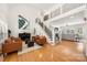 Bright living room showcasing a soaring ceiling, elegant staircase, and hardwood floors at 221 Silvercliff Dr, Mount Holly, NC 28120