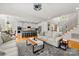 Open concept living room with a view of the kitchen and staircase at 221 Silvercliff Dr, Mount Holly, NC 28120