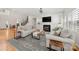 Inviting living room with fireplace and staircase at 221 Silvercliff Dr, Mount Holly, NC 28120