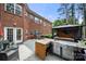 Beautiful deck with an outdoor kitchen and a view of the home's backyard at 221 Silvercliff Dr, Mount Holly, NC 28120