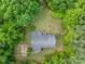 Aerial view of home showing the roof, backyard, and surrounding trees at 231 Stockwood Dr, Stanley, NC 28164