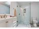 Bright bathroom featuring a glass shower, white vanity, and contemporary fixtures at 231 Stockwood Dr, Stanley, NC 28164