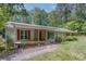 Charming ranch home featuring stone accents, red shutters and a inviting front porch at 231 Stockwood Dr, Stanley, NC 28164