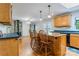 View of kitchen showing the island and dining area with access to the living room at 231 Stockwood Dr, Stanley, NC 28164