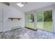 Bright sunroom with a skylight, tiled floor, and access to the backyard with sliding glass doors at 231 Stockwood Dr, Stanley, NC 28164