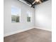 Bright bedroom featuring high ceilings, large windows, and a neutral color palette at 2338 Yadkin Ave # 101, Charlotte, NC 28205