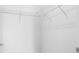 Neat, organized walk-in closet featuring white wire shelving and white walls at 2338 Yadkin Ave # 101, Charlotte, NC 28205
