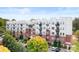 An inviting exterior view of the modern apartment building, featuring brick and metal accents at 2338 Yadkin Ave # 101, Charlotte, NC 28205