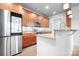 The lovely kitchen offers wood cabinets, granite counters, and stainless steel appliances at 2338 Yadkin Ave # 101, Charlotte, NC 28205