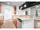 The lovely kitchen includes wood cabinets, granite counters, and stainless steel appliances at 2338 Yadkin Ave # 101, Charlotte, NC 28205