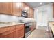 The lovely kitchen offers wood cabinets, granite counters, and stainless steel appliances at 2338 Yadkin Ave # 101, Charlotte, NC 28205