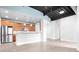 Bright living area showcasing hardwood floors, exposed ceiling, and modern kitchen at 2338 Yadkin Ave # 101, Charlotte, NC 28205
