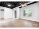 Spacious living room featuring high ceilings, bright windows, and an open floor plan at 2338 Yadkin Ave # 101, Charlotte, NC 28205