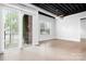 Bright living space featuring exposed ceilings, a sliding glass door, and an open concept at 2338 Yadkin Ave # 101, Charlotte, NC 28205