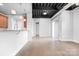 Bright living space featuring an open floor plan, kitchen, and exposed ceilings at 2338 Yadkin Ave # 101, Charlotte, NC 28205